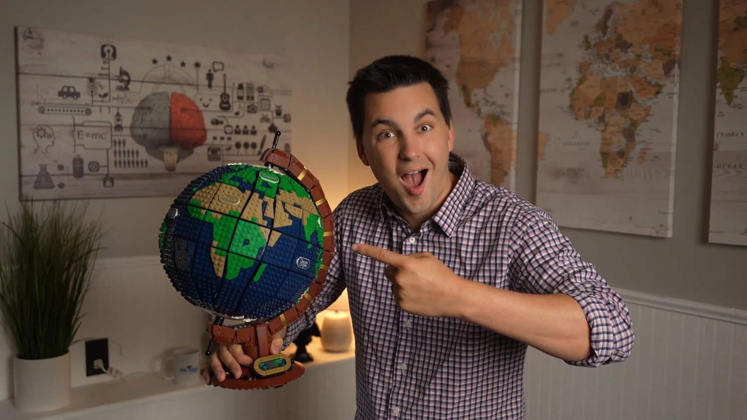 Mr. Sinn pointing at a globe